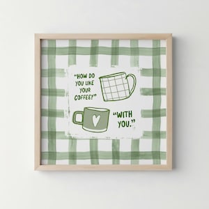 May include: Framed wall art with a green and white checked pattern. The artwork displays two coffee cups and the text "HOW DO YOU LIKE YOUR COFFEE?" and "WITH YOU."