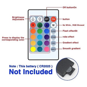 May include: A white remote control with a variety of buttons and a color wheel. The remote control has buttons for "OFF", "ON", "FLASH", "STROBE", "FADE", and "SMOOTH". The color wheel has 16 different colors. The text "Note: This battery (CR2025) Not Included" is printed below the remote control.