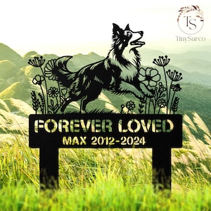 May include: Black metal silhouette of a border collie dog with flowers and the text "FOREVER LOVED MAX 2012-2024" on a black metal sign. The sign is on a green grassy background.