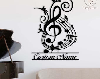 May include: Black metal wall decor featuring a treble clef with musical notes and a customizable nameplate. The nameplate reads "Custom Name".