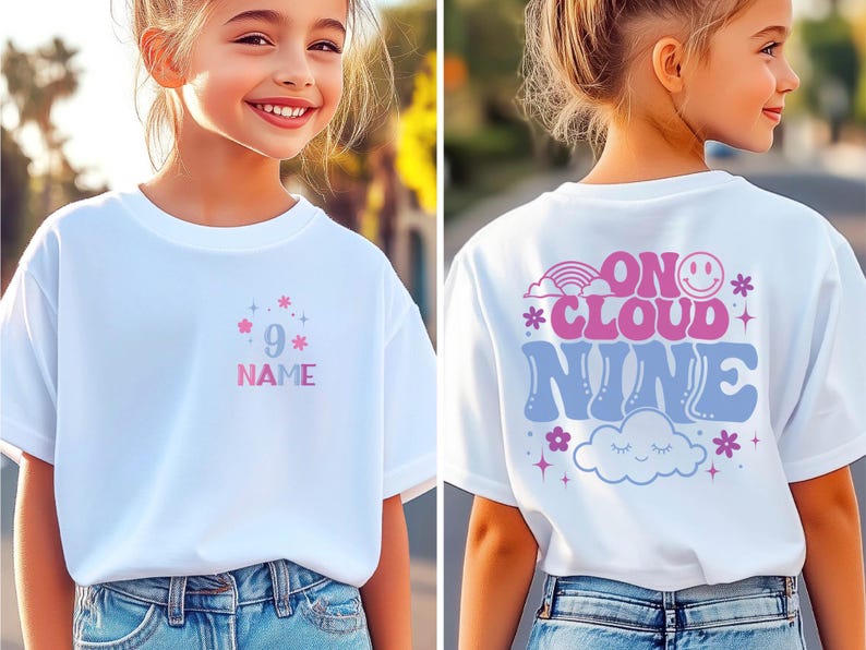 May include: White t-shirt with a colorful design. The front features the number 9, stars, and the word "NAME" in pink and blue. The back says "ON CLOUD NINE" with a rainbow, smiley face, and cloud graphic.