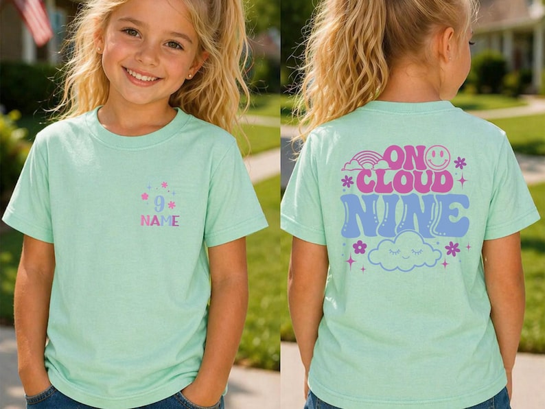 May include: A light green t-shirt with the text "9" and "NAME" in a pocket design. The back of the shirt has the words "ON CLOUD NINE" with a rainbow, smiley face, and cloud graphic.