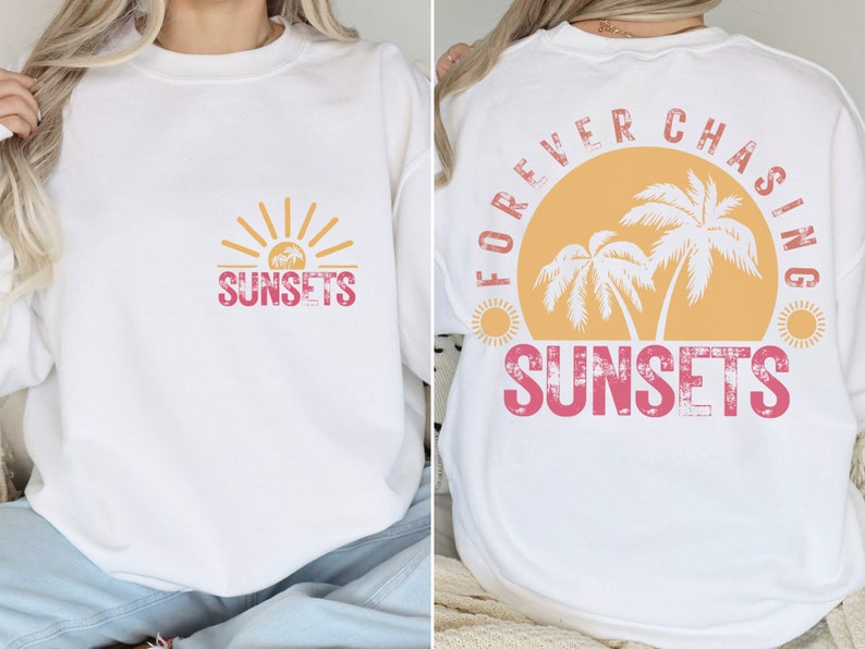 May include: White sweatshirt with a pink and yellow graphic design on the front that says "SUNSETS" and a pink and yellow graphic design on the back that says "FOREVER CHASING SUNSETS" with palm trees and a sun.
