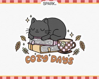 May include: A black cat curled up asleep on a stack of books with a cup of tea and the text "Cozy Days" in brown letters with a heart.
