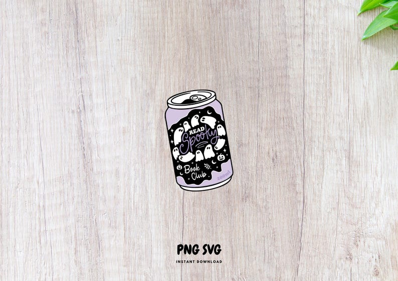 May include: A purple can with a black and white design featuring ghosts, moons, and stars. The text "Read Spooky Book Club" is displayed on the can. The can is set against a light wood grain background.