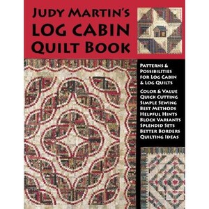 May include: A book cover titled "JUDY MARTIN'S LOG CABIN QUILT BOOK" in red and black. The cover features a detailed quilt pattern in red, cream, and brown. Additional text lists topics like patterns, color, and sewing methods.