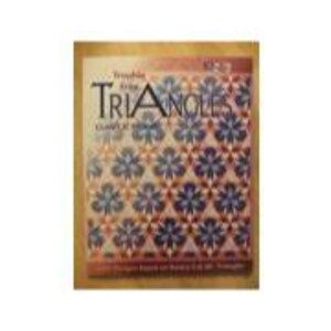 Könnte beinhalten: Ein Buch mit dem Titel "Treasures from Triangles: Complete Guide" mit einem floralen Muster in Blau, Rot und Braun. Das Buch hat einen goldenen Rand und Text oben und unten.