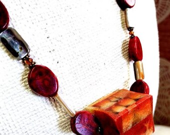 Beautiful Beaded Necklace with large Square Red Bead.