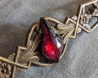 Antique Victorian brooch with rose cut glass ruby