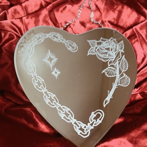 Chain and rose in a heart shaped handmade hand engraved American traditional tattoo style wall decor mirror