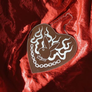 Chain and rose in a heart shaped handmade hand engraved American traditional tattoo style wall decor mirror