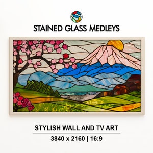 Puede incluir: Una obra de arte de vidrio emplomado que representa una cordillera con un cerezo en flor en primer plano. La obra está enmarcada en un marco de madera claro. El texto "STAINED GLASS MEDLEYS" está en la parte superior de la imagen. El texto "STYLISH WALL AND TV ART" está en la parte inferior de la imagen. El texto "3840 x 2160 | 16:9" está debajo del texto "STYLISH WALL AND TV ART".
