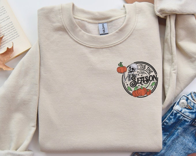 Embroidery Pocket Size, Cozy Fall Halloween Sweatshirt - 'Tis the Season' Skeleton and Pumpkin Design - Soft Beige Spooky Autumn Vibes"