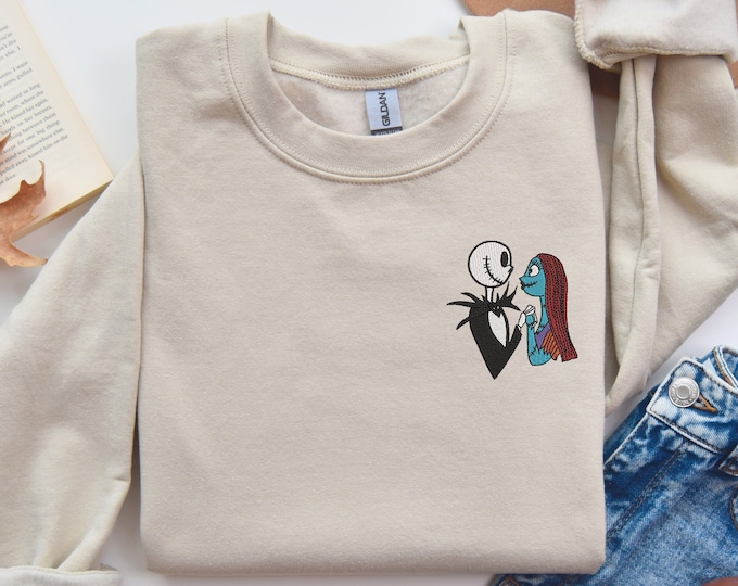 Celestial Whisper: Embroidered Pocket Angel & Curious Creature - Enigmatic Grey Tee for Halloween Nights, Pocket Size Halloween Sweatshirt