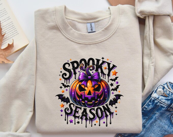 Spooky Season Pumpkin Sweatshirt, Halloween Pumpkin Graphic Tee, Cozy Fall Apparel for Women, Trendy Autumn Clothing, Perfect Hallowen Gift