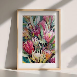 May include: A framed art print featuring a vibrant floral arrangement. The artwork showcases a bouquet of protea flowers in shades of pink, yellow, and green, set against a teal background. The print is encased in a light brown wooden frame.