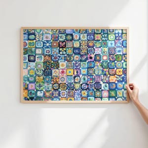 May include: A framed artwork showing a mosaic of square tiles, each with a unique floral or geometric design. The artwork's palette includes blues, greens, yellows, and pinks, creating a vibrant piece. The frame is a light wood colour.