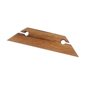May include: A wooden wine bottle holder with two cutouts for holding bottles. The holder is made of light brown wood with a natural grain pattern.