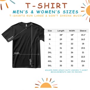 May include: A black t-shirt with a size chart showing measurements in inches. The chart includes sizes S through 5XL with corresponding length, width, and sleeve measurements. The text "T-SHIRT MEN'S & WOMEN'S SIZES T-SHIRTS RUN LARGE & DON'T SHRINK MUCH" is at the top of the chart. The text "GILDEN 5000 HEAVY DUTY UNISEX T-SHIRT MEASUREMENTS ARE IN INCHES" is at the bottom of the chart.