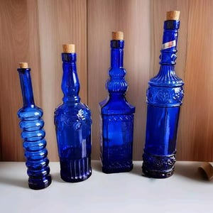 Vintage Cobalt Blue Glass Bottles Embossed Each With Different  Design Made in Spain