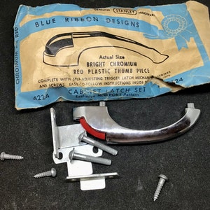 May include: A chrome cabinet latch set with a red plastic thumb piece. The packaging says "Blue Ribbon Designs" and "Bright Chromium". The set includes screws and instructions. The product number is 4224.