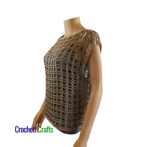 May include: A beige crochet top featuring an open grid pattern with short sleeves and a round neckline, layered over a solid dark gray garment. The text CrochethCrafts is visible in the bottom left corner in blue and green lettering.