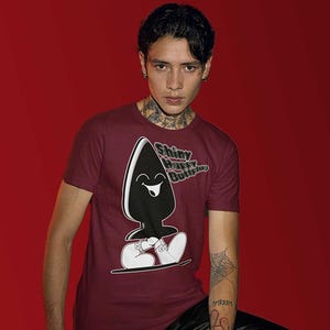 Shiny Happy Buttplug T-Shirt – Fun Kink-Inspired Tee with Extra-Large Design Print – Perfect for Pride, LGBTQ+ Fashion, and Quirky Gifts