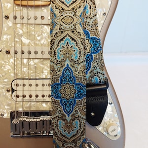 gold and blue paisley guitar strap