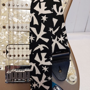 white birds on black batik guitar strap