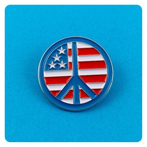 May include: A round, blue-rimmed pin featuring a peace symbol design. The pin incorporates the American flag with red and white stripes, white stars, and a blue field. The peace symbol is blue.