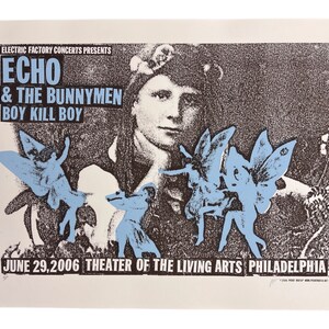 May include: A black and white concert poster with a grainy texture. The poster advertises a concert for Echo & The Bunnymen and Boy Kill Boy. The poster features a woman's face with a crown of flowers and several blue butterflies. The text on the poster reads "Electric Factory Concerts Presents Echo & The Bunnymen Boy Kill Boy June 29, 2006 Theater of the Living Arts Philadelphia."