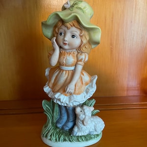 Little Girl with Lamb Figurine