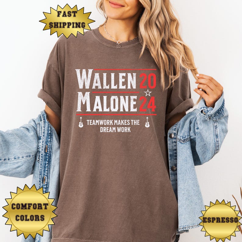 May include: A brown t-shirt with the text "Wallen 20 Malone 24" in red and white. The text "Teamwork makes the dream work" is below the names in black.