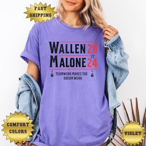 May include: A purple t-shirt with the text "Wallen 20 Malone 24" and the words "Teamwork makes the dream work" printed on it.