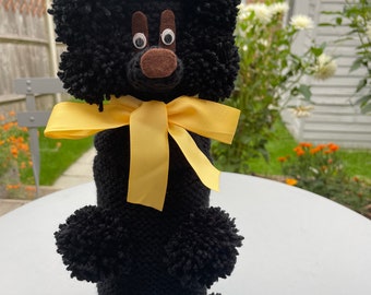Frank - a black Gin Poodle with a custard yellow ribbon bow
