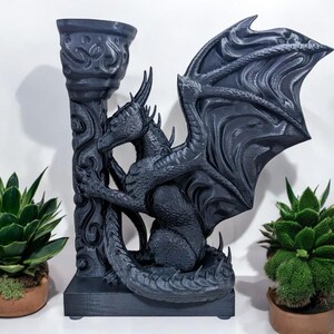 A 3D-printed Dragon Bookend, featuring intricate wings, fierce claws, and customizable color options. This mythical dragon bookend is both decorative and functional, perfect for fantasy lovers, book collectors, and unique bookshelf organization.