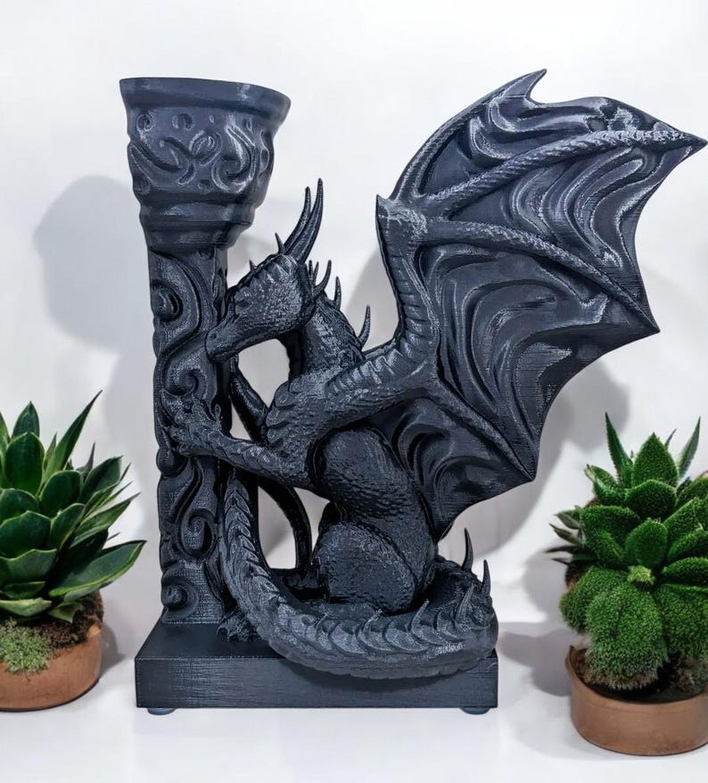 A 3D-printed Dragon Bookend, featuring intricate wings, fierce claws, and customizable color options. This mythical dragon bookend is both decorative and functional, perfect for fantasy lovers, book collectors, and unique bookshelf organization.