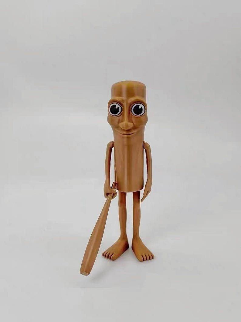 May include: A brown figurine of a person with large eyes and a smile, holding a wooden baseball bat. The figurine has a cylindrical body and long, thin legs.