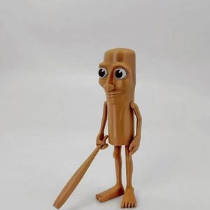 May include: A brown figurine of a person with large eyes and a wooden baseball bat. The figurine is standing with its legs slightly apart and its arms bent at the elbows. The figurine is made of a smooth, brown material.