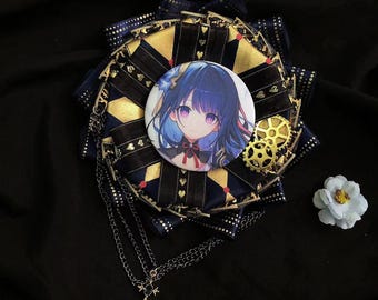 May include: A black and gold decorative pin with a round, blue and purple anime character illustration in the center. The pin has a chain with a key charm attached.