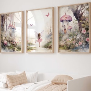 May include: A set of three framed watercolour prints depicting fairy tale scenes. Each print features a different scene: a fairy on a path, a castle, and a mushroom house, all in soft pastel colours and surrounded by flowers.