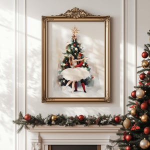 May include: A framed watercolour painting of a ballerina dancing with a nutcracker soldier under a Christmas tree. The painting is in a gold frame and is hanging on a white wall.