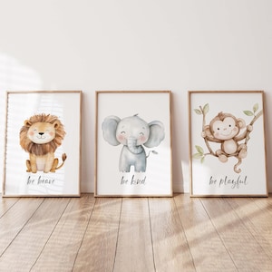May include: Three framed watercolour prints depicting cute jungle animals. The first print shows a lion with the text "be brave". The second print shows an elephant with the text "be kind". The third print shows a monkey with the text "be playful".