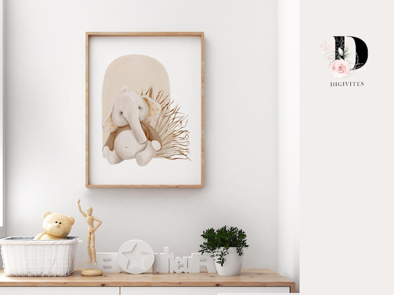 May include: A watercolor illustration of a brown and gray elephant with a brown and beige background. The elephant is sitting in a patch of brown and beige grass. The illustration is framed in a light brown frame.