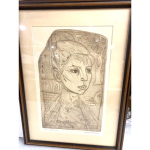 May include: A framed etching on paper featuring a portrait of a person with stylized facial features, set against a background with architectural elements including arches and brickwork. The artwork is signed and titled in pencil at the bottom.