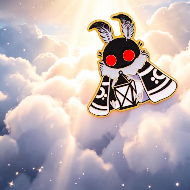 May include: A black and white moth pin with red eyes and a gold border. The moth is holding a white lantern. The background is a cloudy sky with sun rays.