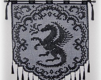 May include: Black crocheted wall hanging with a black bird design and fringe tassels.