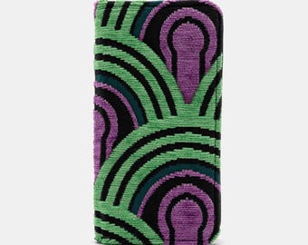 May include: A green, purple and black patterned clutch with a geometric design.