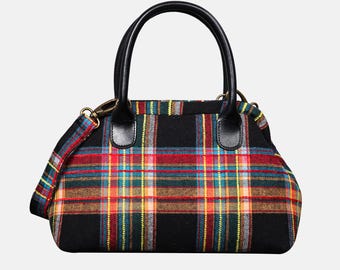 May include: A black handbag with a colorful plaid pattern in red, yellow, blue, and green. The bag has black leather handles and a detachable shoulder strap. The hardware is gold-colored.