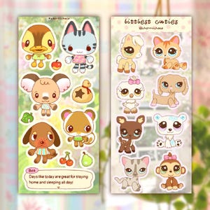 May include: Two sticker sheets featuring cartoon animal characters. The left sheet includes a duck, cat, koala, dog, squirrel, apple, leaf, cherries, pear, and a text box reading: Bea Days like today are great for staying home and sleeping all day.